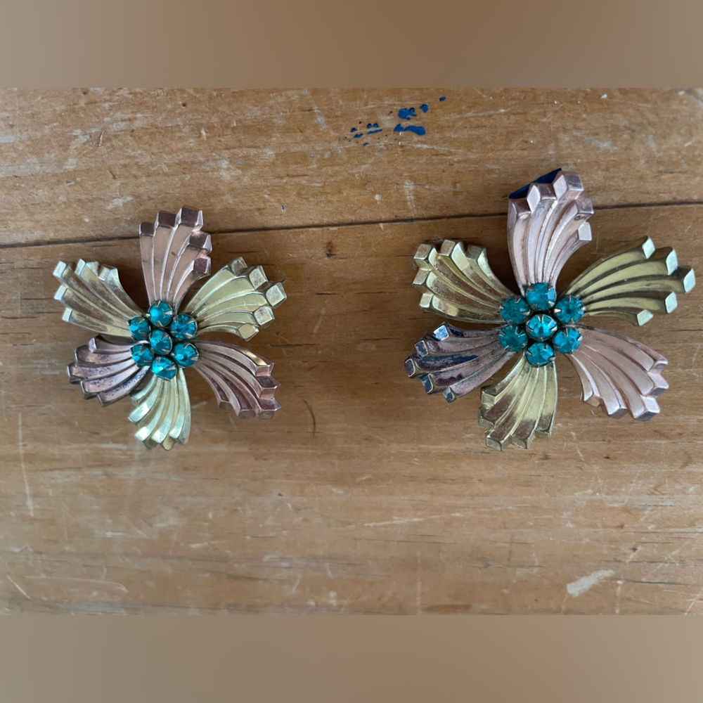 Set of two matching bronze and gold tone flower brooches